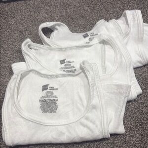 Boys size medium White Tank Tops- used in great condition 3 pairs for 12 dollars